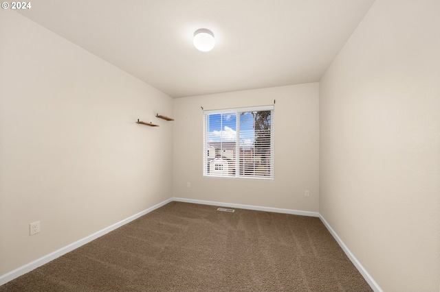 spare room featuring carpet floors