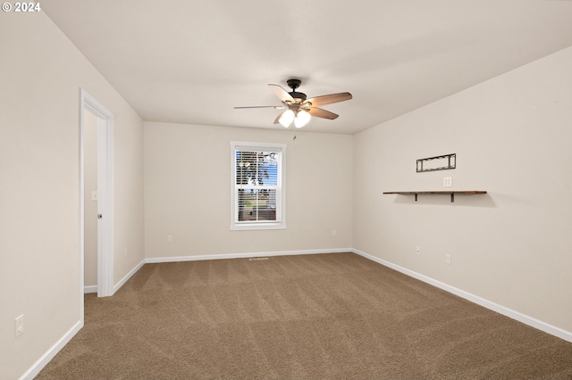 empty room with carpet and ceiling fan