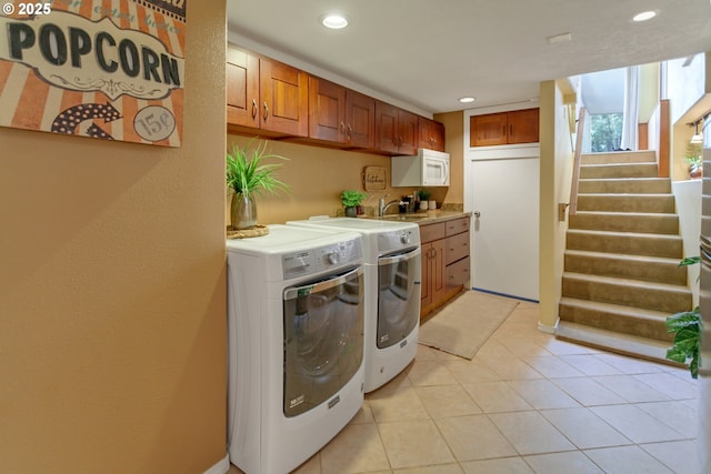 3329 SE Steele St, Portland, OR 97202 - laundry area featuring separate washer and dryer, recessed lighting, and light tile patterned floors