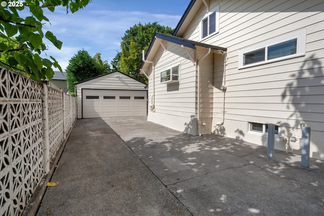 3329 SE Steele St, Portland, OR 97202 - view of property exterior with a garage and an outbuilding