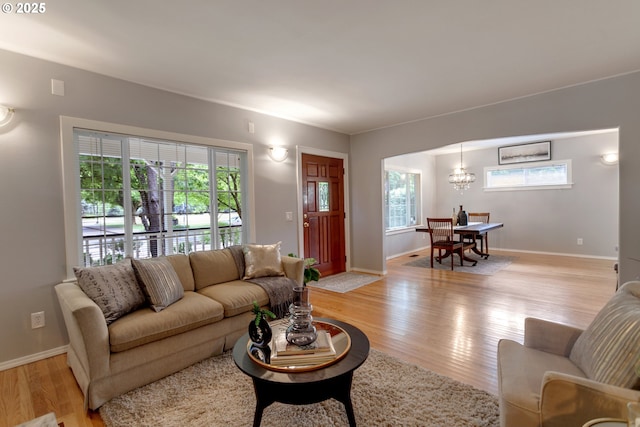 3329 SE Steele St, Portland, OR 97202 - living area featuring light wood finished floors and a chandelier