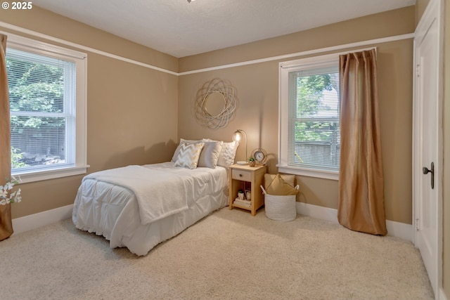 3329 SE Steele St, Portland, OR 97202 - bedroom featuring multiple windows and carpet