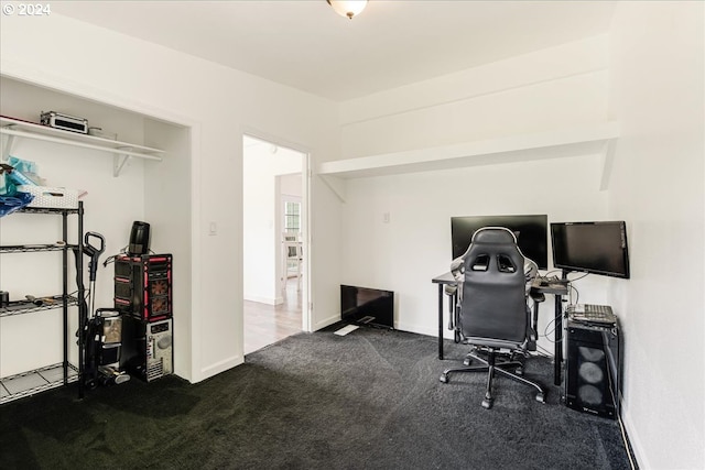 home office featuring dark colored carpet