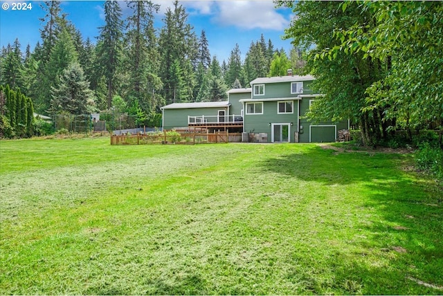 view of yard with a wooden deck