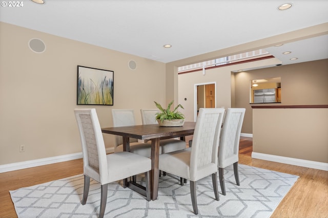 dining area featuring light wood-type flooring