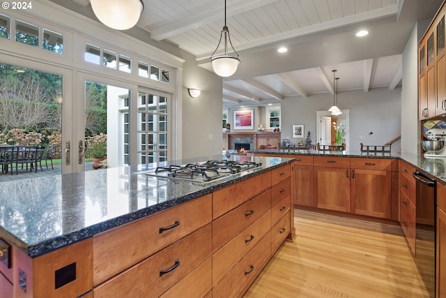 kitchen with decorative light fixtures, stainless steel gas cooktop, and beamed ceiling