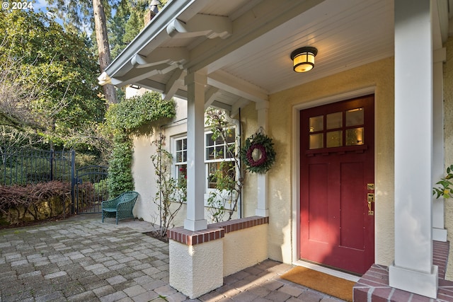 doorway to property featuring a porch