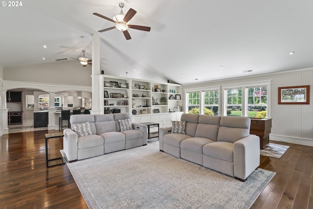 living room featuring lofted ceiling, wooden walls, dark hardwood / wood-style floors, and ceiling fan