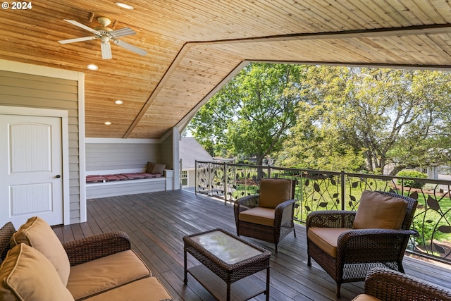 wooden terrace featuring ceiling fan and outdoor lounge area