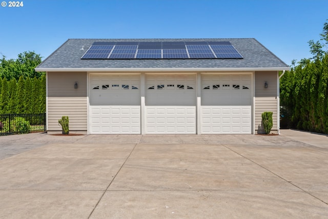 garage featuring solar panels