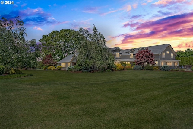 view of yard at dusk