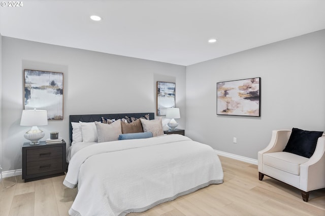 bedroom with light hardwood / wood-style flooring