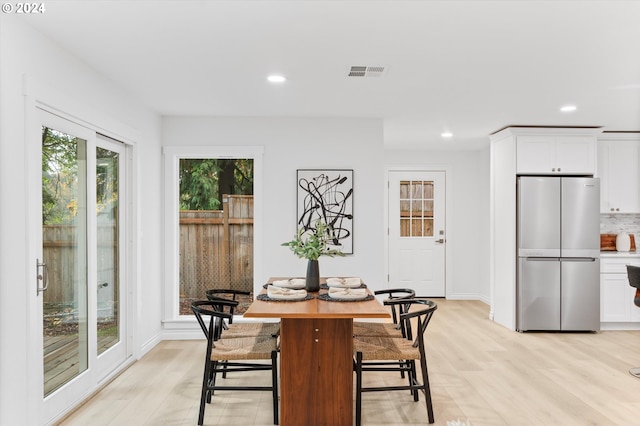 dining room with light hardwood / wood-style flooring