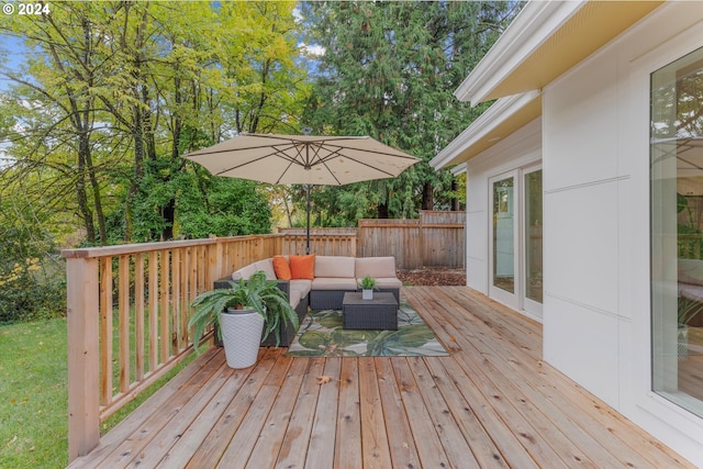 wooden terrace featuring outdoor lounge area