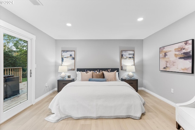 bedroom with access to exterior and light wood-type flooring