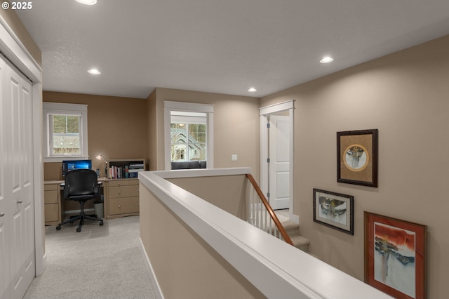 office area with baseboards, recessed lighting, plenty of natural light, and light colored carpet