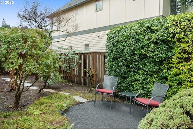 view of patio featuring fence