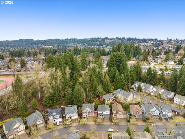 birds eye view of property with a residential view