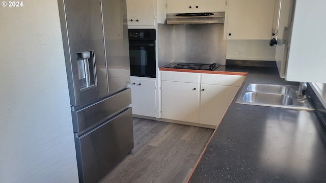 kitchen with black appliances, hardwood / wood-style flooring, sink, and white cabinets