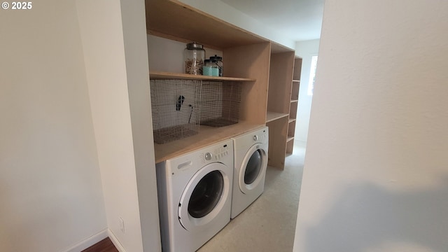 laundry area featuring laundry area, baseboards, and independent washer and dryer