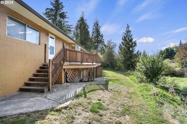 view of yard with a deck and stairway