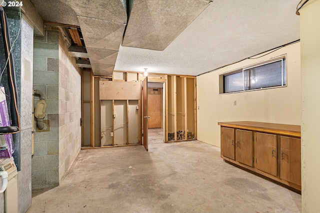 basement with a textured ceiling