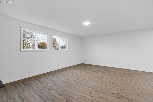 spare room with hardwood / wood-style floors