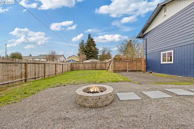 view of yard with an outdoor fire pit