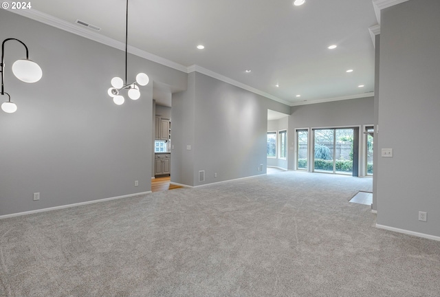 unfurnished living room with light colored carpet, crown molding, and a chandelier