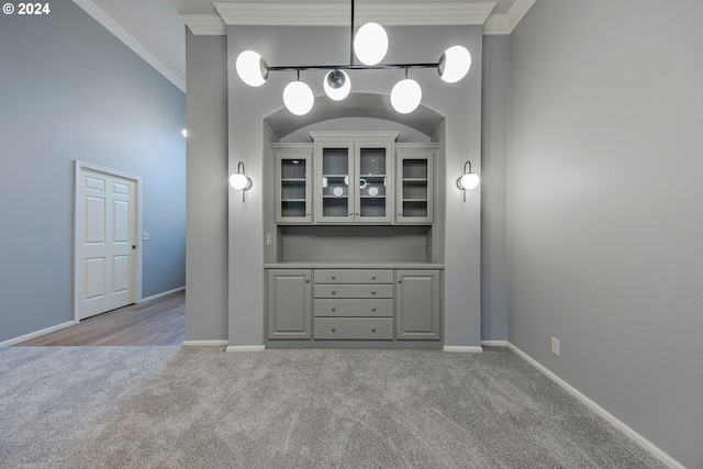 interior space with crown molding