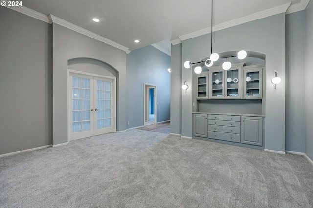 interior space featuring light carpet, french doors, and ornamental molding