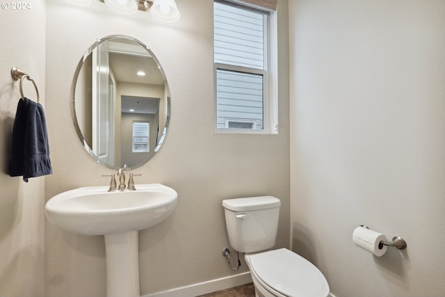 bathroom featuring sink and toilet