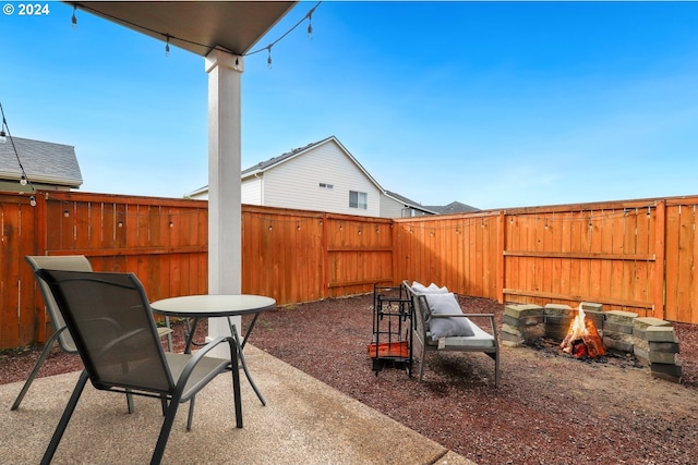 view of patio featuring a fire pit