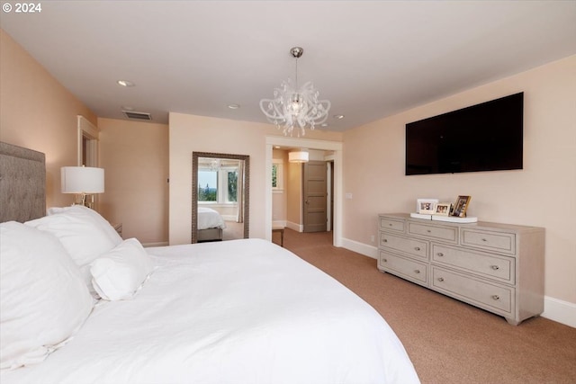 carpeted bedroom with an inviting chandelier