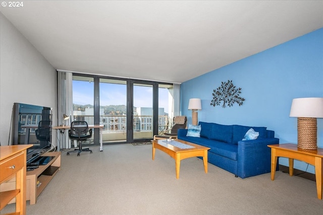 carpeted living room featuring a wall of windows