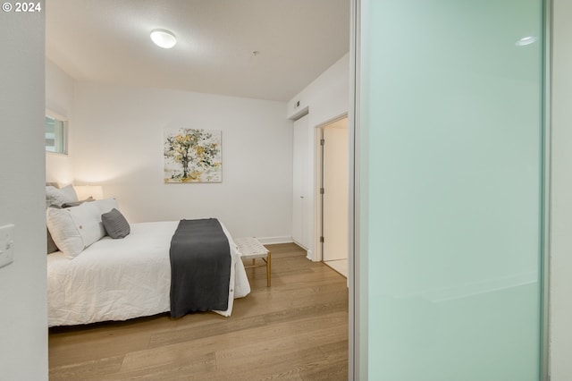 bedroom featuring wood-type flooring