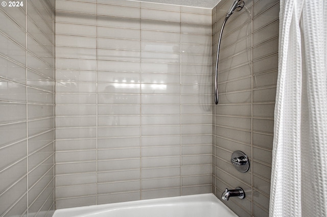 bathroom featuring shower / bathtub combination with curtain