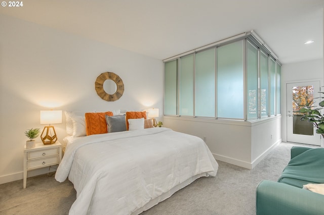 bedroom with light colored carpet