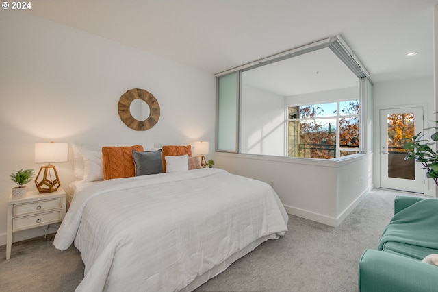 bedroom featuring light colored carpet