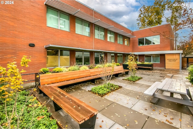 rear view of property featuring a patio area