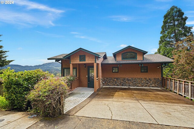 view of front of home featuring a mountain view