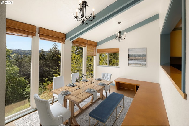 sunroom featuring vaulted ceiling with beams and a notable chandelier