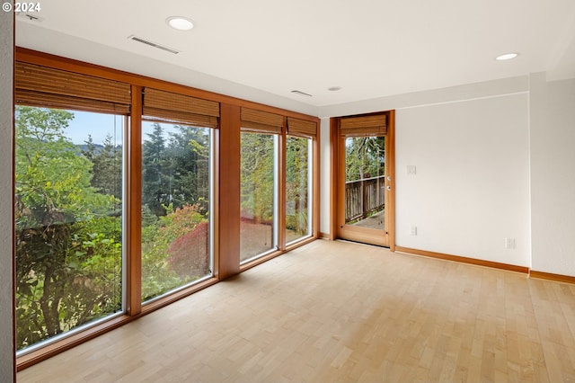 unfurnished room featuring light hardwood / wood-style flooring