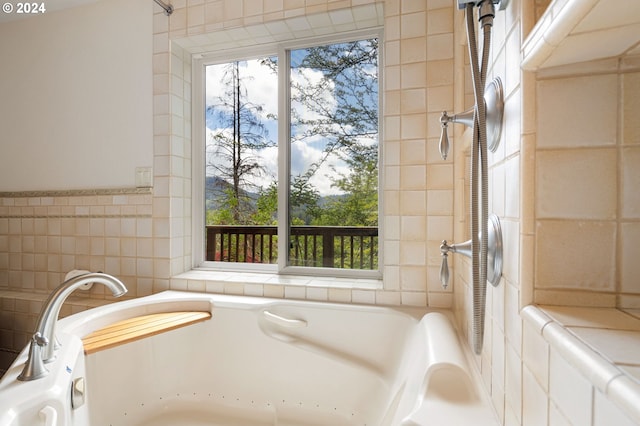 bathroom with tile walls and a tub to relax in