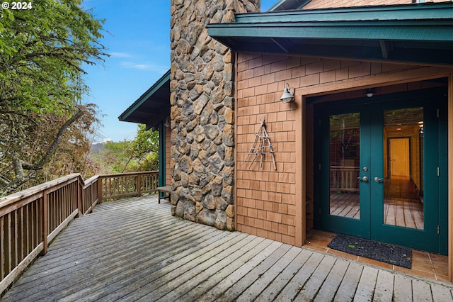 entrance to property with a deck and french doors