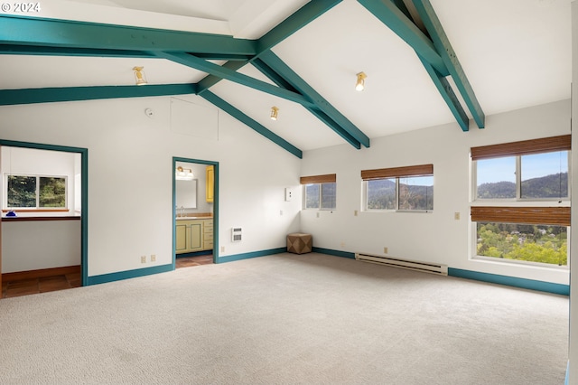 carpeted spare room featuring lofted ceiling with beams, sink, and baseboard heating