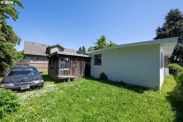 back of house featuring a yard