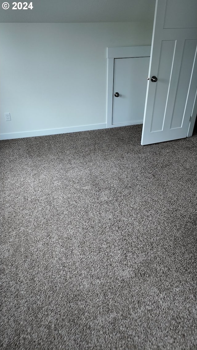 empty room featuring carpet flooring