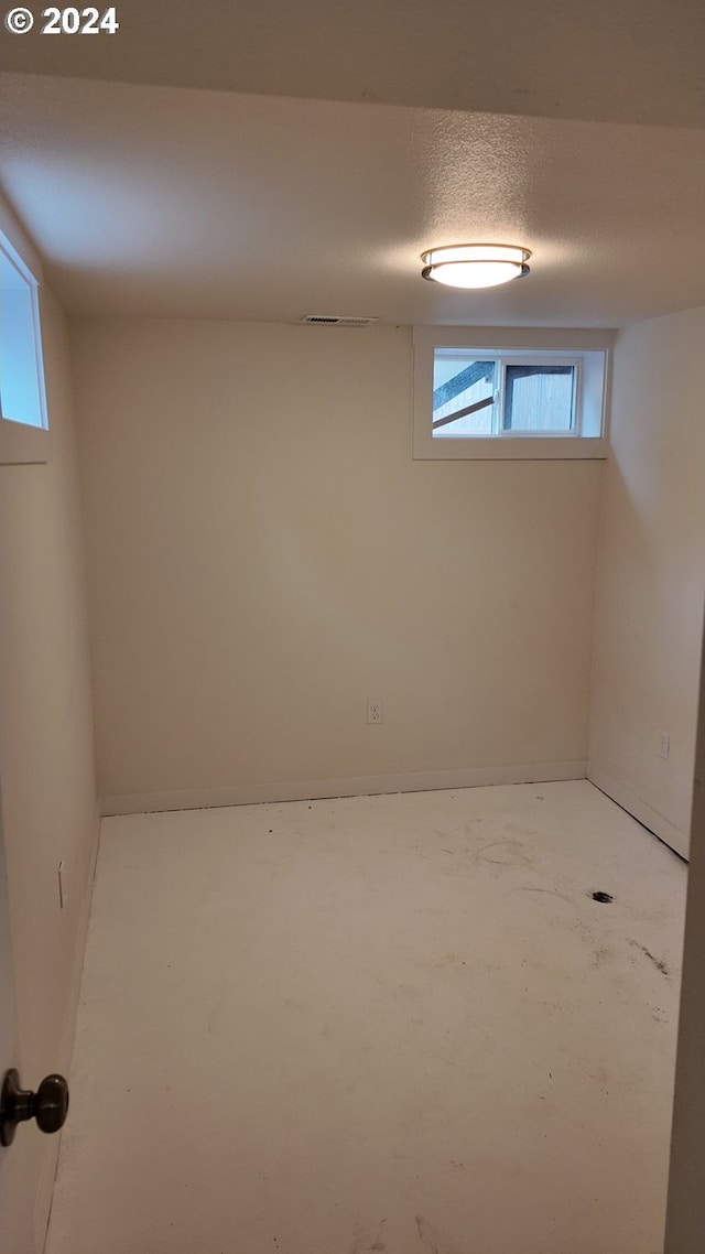 basement with a textured ceiling