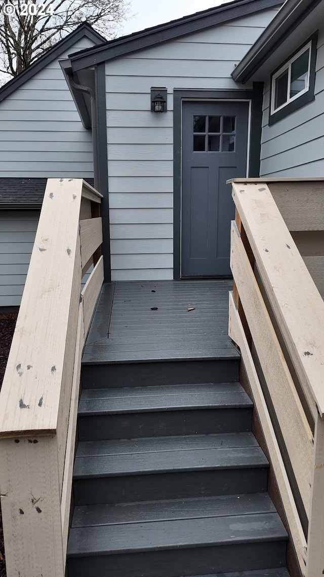 property entrance featuring a wooden deck